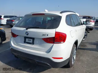 2014 BMW X1 xDrive28i with VIN WBAVL1C52EVY23658, listed as a IAAI auction lot 41153436 with 26,791 mi miles. Bid and sale history available at carsss.com. Image 4.