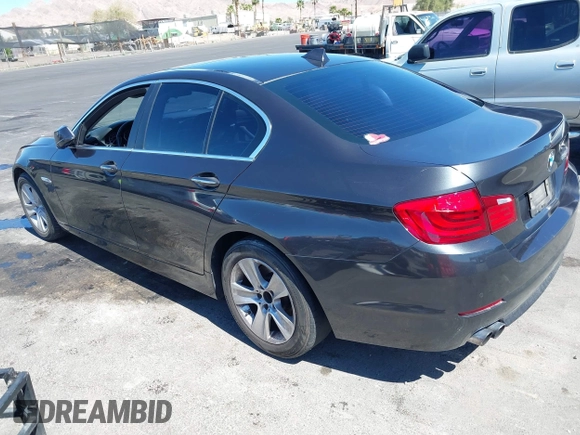 2013 BMW 5 Series 528i with VIN WBAXG5C58DD232582, listed as a IAAI auction lot 41890082 with 150,401 mi miles and . Bid and sale history available at carsss.com. Image 3.