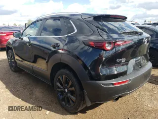 2022 Mazda CX-30 2.5 Turbo with VIN 3MVDMBAY0NM447128, listed as a Copart auction lot 54007924 with 10,596 mi miles and Salvage Title. Bid and sale history available at DreamBid. Image 2.