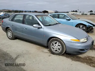 2002 Saturn LS z VIN 1G8JU54F32Y529705, wystawiony jako Copart lot #71895554 z przebiegiem 60 088 mil mil oraz Szkody całkowita. Historia ofert i sprzedaży dostępna na DreamBid. Obrazek 4.