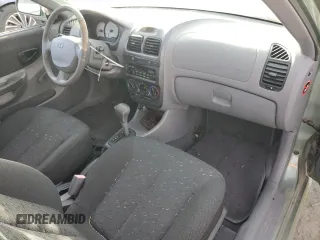 2003 Hyundai Accent GL with VIN KMHCG35CX3U242848, listed as a Copart auction lot 86558394 with 56,248 mi miles and Salvage Title. Bid and sale history available at carsss.com. Image 8.