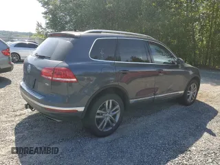 2015 Volkswagen Touareg Lux z VIN WVGEP9BP0FD006992, wystawiony jako Copart lot #59524445 z przebiegiem 169 822 mil mil oraz Szkoda całkowita • Salvage title. Historia ofert i sprzedaży dostępna na DreamBid. Obrazek 3.
