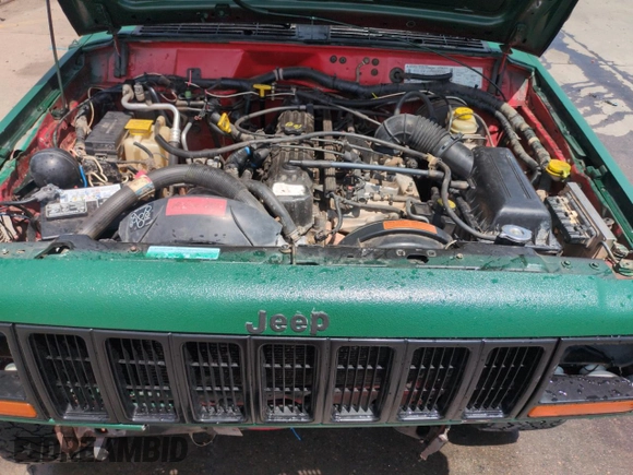 1998 Jeep Cherokee Sport with VIN 1J4FJ68SXWL210381, listed as a Copart auction lot 58398995 with 211,870 mi miles and Salvage title. Bid and sale history available at DreamBid. Image 12.