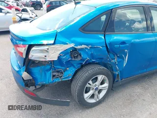 2014 Ford Focus SE z VIN 1FADP3F20EL452324, wystawiony jako IAAI lot #40097434 z przebiegiem 131 789 mil mil oraz . Historia ofert i sprzedaży dostępna na DreamBid. Obrazek 6.