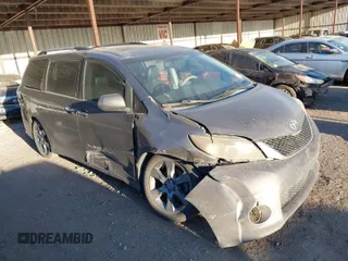 2014 Toyota Sienna SE with VIN 5TDXK3DC1ES462473, listed as a IAAI auction lot 41811437 with 209,704 mi miles. Bid and sale history available at carsss.com. Image 1.