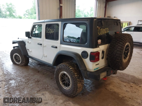 2022 Jeep Wrangler Unlimited Rubicon with VIN 1C4JJXFM0NW154202, listed as a IAAI auction lot 42400067 with 60,486 mi miles and . Bid and sale history available at DreamBid. Image 3.
