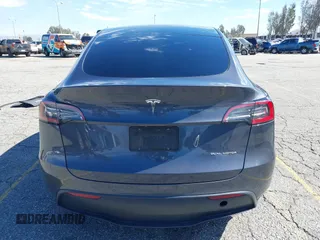 2022 Tesla Model Y Long Range with VIN 7SAYGAEEXNF381389, listed as a IAAI auction lot 41613075 with 52,800 mi miles and . Bid and sale history available at carsss.com. Image 16.