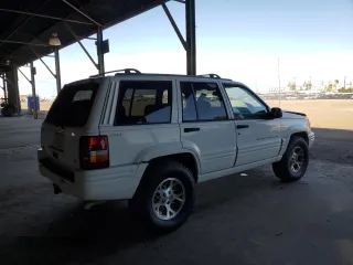 1996 Jeep Grand Cherokee with VIN 1J4EZ78Y9TC104398, listed as a Copart auction lot 69706254 with Not provided miles and Salvage title. Bid and sale history available at DreamBid. Image 3.