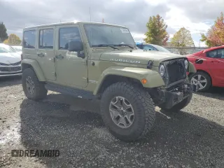 2013 Jeep Wrangler Unlimited Rubicon 10th Anniversary with VIN 1C4HJWFG4DL549065, listed as a Copart auction lot 75899594 with 127,960 mi miles and Salvage title. Bid and sale history available at DreamBid. Image 4.