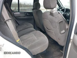 2004 GMC Envoy SLE with VIN 1GKDT13SX42357048, listed as a IAAI auction lot 41601126 with 304,101 mi miles. Bid and sale history available at carsss.com. Image 8.