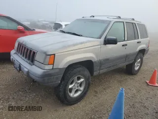 1997 Jeep Grand Cherokee Laredo with VIN 1J4GZ58Y6VC603370, listed as a Copart auction lot 82802794 with 0 mi miles and Salvage Title. Bid and sale history available at carsss.com. Image 1.