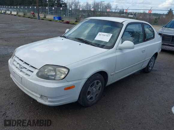 2004 Hyundai Accent GL with VIN KMHCG35C74U303431, listed as a IAAI auction lot 41725717 with 211,893 mi miles. Bid and sale history available at carsss.com. Image 2.