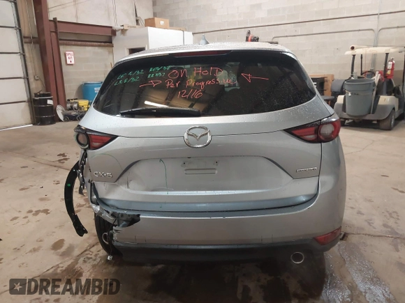 2021 Mazda CX-5 Grand Touring with VIN JM3KFADMXM1318015, listed as a IAAI auction lot 41221528 with 79,473 mi miles. Bid and sale history available at carsss.com. Image 16.