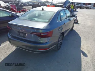 2021 Volkswagen Jetta S z VIN 3VWC57BU8MM098931, wystawiony jako IAAI lot #41818622 z przebiegiem 10 469 mil mil oraz . Historia ofert i sprzedaży dostępna na DreamBid. Obrazek 4.
