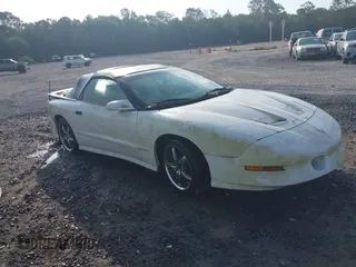 1995 Pontiac Firebird Trans Am z VIN 2G2FV32P8S2217647, wystawiony jako IAAI lot #42115118 z przebiegiem 154 499 mil mil oraz . Historia ofert i sprzedaży dostępna na DreamBid. Obrazek 1.