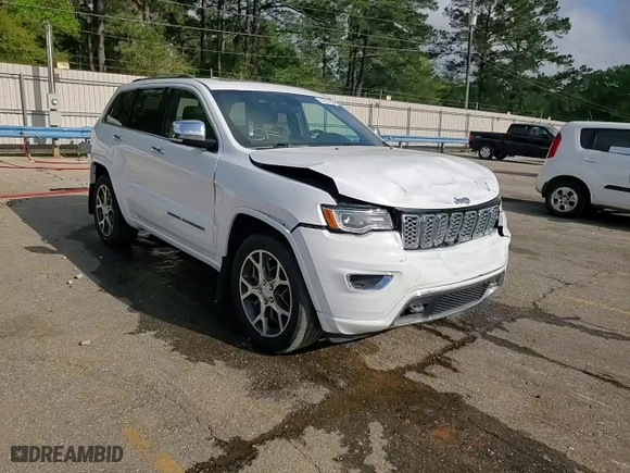 2019 Jeep Grand Cherokee Overland with VIN 1C4RJECG4KC833019, listed as a Copart auction lot 51277555 with 124,072 mi miles and Salvage Title. Bid and sale history available at carsss.com. Image 14.
