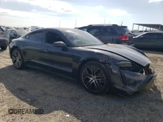 2023 Porsche Taycan with VIN WP0AA2Y18PSA16703, listed as a Copart auction lot 50559135 with 11,428 mi miles and Salvage Title. Bid and sale history available at DreamBid. Image 4.