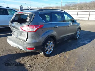 2014 Ford Escape SE z VIN 1FMCU9GXXEUB99093, wystawiony jako IAAI lot #41662040 z przebiegiem 120 783 mil mil oraz . Historia ofert i sprzedaży dostępna na DreamBid. Obrazek 4.
