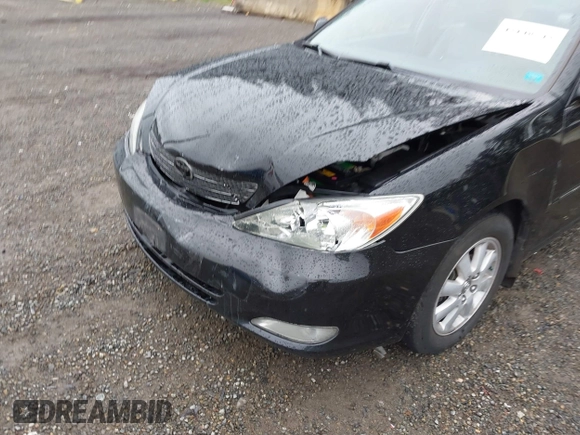 2003 Toyota Camry LE z VIN 4T1BF30KX3U049919, wystawiony jako IAAI lot #42148543 z przebiegiem 208 140 mil mil oraz . Historia ofert i sprzedaży dostępna na DreamBid. Obrazek 5.