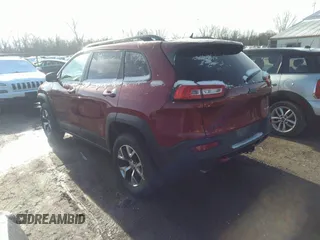 2014 Jeep Cherokee Trailhawk with VIN 1C4PJMBS9EW161047, listed as a IAAI auction lot 41841038 with Not Provided miles. Bid and sale history available at carsss.com. Image 3.