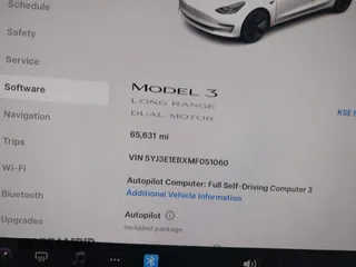 2021 Tesla Model 3 Long Range with VIN 5YJ3E1EBXMF051060, listed as a IAAI auction lot 41958018 with 65,631 mi miles. Bid and sale history available at carsss.com. Image 7.