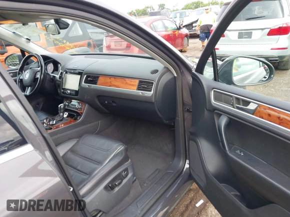 2012 Volkswagen Touareg Sport with VIN WVGFK9BP0CD002939, listed as a IAAI auction lot 42531654 with 222,435 mi miles and . Bid and sale history available at DreamBid. Image 5.
