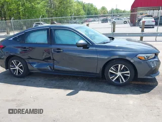 2024 Honda Civic LX z VIN 19XFL2H57RE021316, wystawiony jako IAAI lot #42031580 z przebiegiem 18 598 mil mil oraz . Historia ofert i sprzedaży dostępna na DreamBid. Obrazek 13.