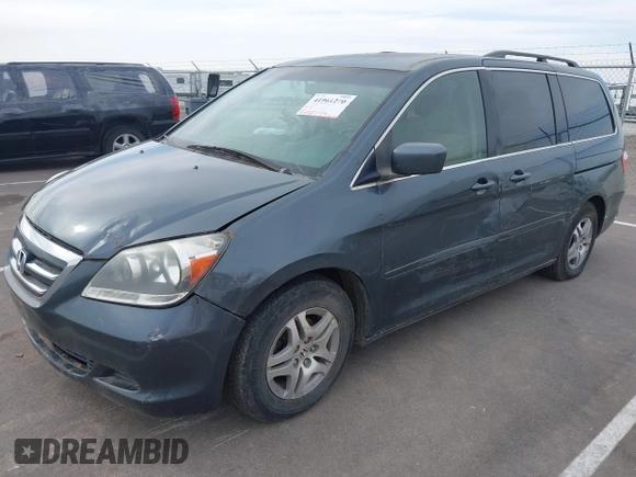 2005 Honda Odyssey EX with VIN 5FNRL38465B108123, listed as a IAAI auction lot 41961270 with 169,948 mi miles. Bid and sale history available at carsss.com. Image 6.