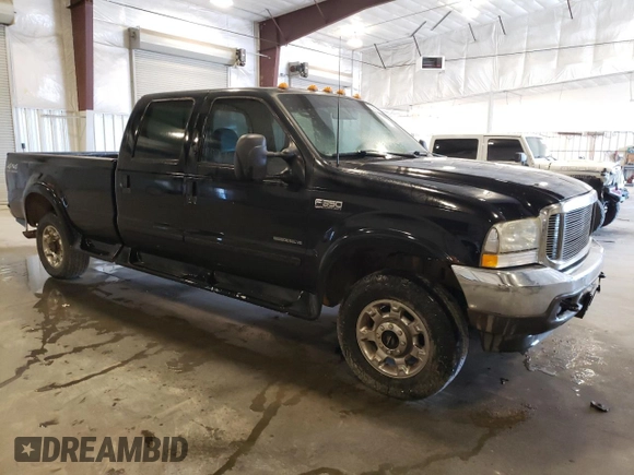 2002 Ford F-350 XL with VIN 1FTSW31F92EC17984, listed as a Copart auction lot 55821575 with 346,645 mi miles and Salvage title. Bid and sale history available at DreamBid. Image 4.