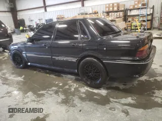 1988 Mitsubishi Galant with VIN E39A0010917, listed as a Copart auction lot 44421775 with 14,813 mi miles and Salvage Title. Bid and sale history available at DreamBid. Image 2.