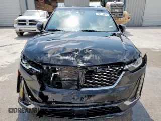 2020 Cadillac XT6 FWD Premium Luxury z VIN 1GYKPCRSXLZ104502, wystawiony jako Copart lot #58211275 z przebiegiem 97 053 mil mil oraz Szkody całkowita. Historia ofert i sprzedaży dostępna na DreamBid. Obrazek 5.