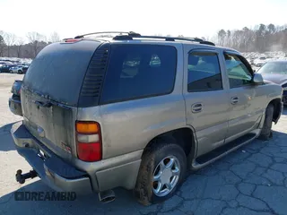 2002 GMC Yukon Denali z VIN 1GKEK63U82J341696, wystawiony jako IAAI lot #41772116 z przebiegiem 259 337 mil mil oraz . Historia ofert i sprzedaży dostępna na DreamBid. Obrazek 4.