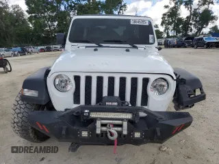 2023 Jeep Wrangler Sport с VIN 1C4HJXDGXPW596127, выставлен на аукционе Copart как лот 56645205 с пробегом 64 257 миль миль и Списание • Salvage title. История ставок и продаж доступна на DreamBid. Изображение 5.