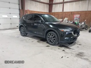 2017 Mazda CX-5 Grand Touring with VIN JM3KFBDL6H0143013, listed as a IAAI auction lot 41912979 with 122,890 mi miles. Bid and sale history available at carsss.com. Image 1.