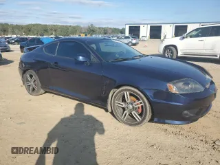 2005 Hyundai Tiburon GT z VIN KMHHN65F85U158764, wystawiony jako Copart lot #80060884 z przebiegiem 121 747 mil mil oraz Czysty tytuł • Clean title. Historia ofert i sprzedaży dostępna na DreamBid. Obrazek 4.