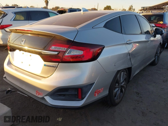 2018 Honda Clarity with VIN JHMZC5F15JC018312, listed as a IAAI auction lot 41354648 with 97,035 mi miles and . Bid and sale history available at DreamBid. Image 4.