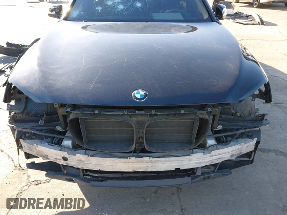 2014 BMW 7 Series 740Li with VIN WBAYE4C56ED137847, listed as a IAAI auction lot 39452255 with 184,471 mi miles. Bid and sale history available at carsss.com. Image 6.