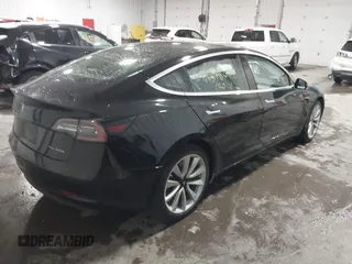 2018 Tesla Model 3 Long Range Battery with VIN 5YJ3E1EB7JF086778, listed as a IAAI auction lot 41348008 with 74,491 mi miles and . Bid and sale history available at DreamBid. Image 4.