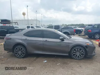 2023 Toyota Camry LE z VIN 4T1C11AK8PU132325, wystawiony jako IAAI lot #42093856 z przebiegiem 29 115 mil mil oraz . Historia ofert i sprzedaży dostępna na DreamBid. Obrazek 14.