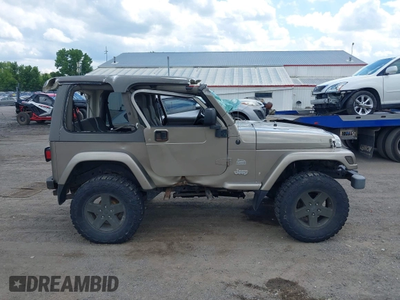 2004 Jeep Wrangler Sahara with VIN 1J4FA59S54P740417, listed as a IAAI auction lot 42382078 with 200,108 mi miles and . Bid and sale history available at DreamBid. Image 14.