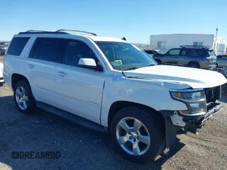 2015 Chevrolet Tahoe LT with VIN 1GNSCBKCXFR218669, listed as a IAAI auction lot 41829584 with 153,804 mi miles and . Bid and sale history available at DreamBid. Image 1.