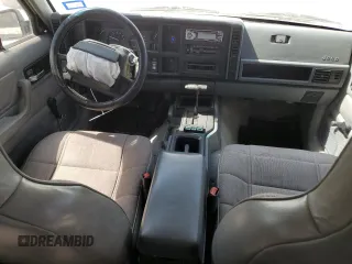 1996 Jeep Cherokee Sport with VIN 1J4FJ68S1TL128597, listed as a Copart auction lot 49600545 with 201,074 mi miles and Salvage title. Bid and sale history available at DreamBid. Image 8.