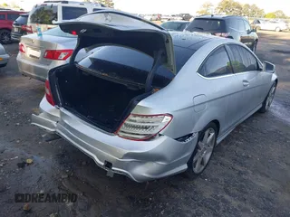 2015 Mercedes-Benz C with VIN WDDGJ4HB1FG372798, listed as a IAAI auction lot 41968536 with 56,007 mi miles. Bid and sale history available at carsss.com. Image 4.