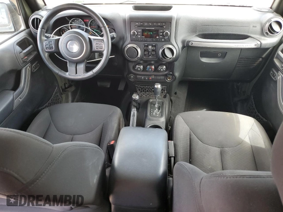 2015 Jeep Wrangler Unlimited Sport with VIN 1C4BJWDG4FL766904, listed as a Copart auction lot 58126555 with 68,400 mi miles and Salvage title. Bid and sale history available at DreamBid. Image 8.