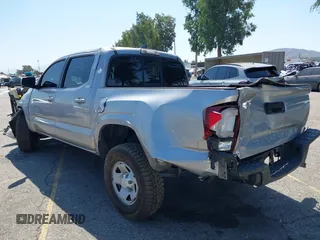 2018 Toyota Tacoma SR with VIN 5TFAX5GN2JX103685, listed as a IAAI auction lot 42392032 with 138,678 mi miles and . Bid and sale history available at DreamBid. Image 3.