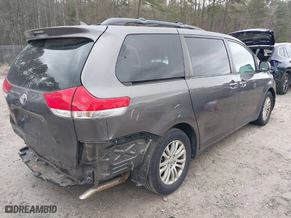 2012 Toyota Sienna XLE AAS with VIN 5TDYK3DC2CS276118, listed as a IAAI auction lot 41834422 with 143,043 mi miles. Bid and sale history available at carsss.com. Image 4.