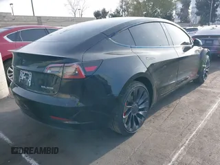 2023 Tesla Model 3 Performance z VIN 5YJ3E1EC3PF716085, wystawiony jako IAAI lot #41911684 z przebiegiem 45 184 mil mil oraz . Historia ofert i sprzedaży dostępna na DreamBid. Obrazek 4.