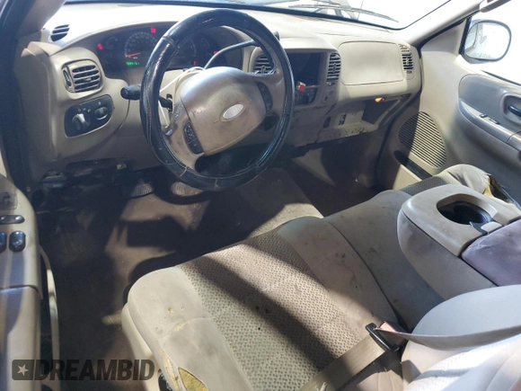 2003 Ford F-150 XL with VIN 1FTRX17283NA46215, listed as a Copart auction lot 85194094 with 168,415 mi miles and Salvage title. Bid and sale history available at DreamBid. Image 8.
