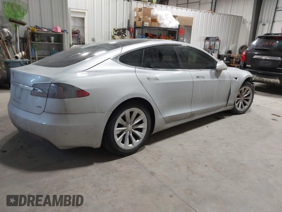 2017 Tesla Model S 100D with VIN 5YJSA1E23HF232059, listed as a IAAI auction lot 41394046 with 84,052 mi miles and . Bid and sale history available at DreamBid. Image 4.