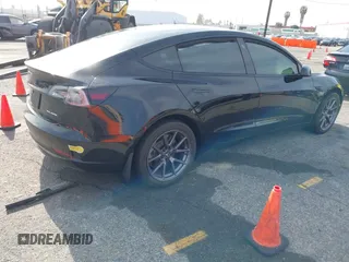 2022 Tesla Model 3 Long Range with VIN 5YJ3E1EB6NF233131, listed as a IAAI auction lot 41819409 with 38,308 mi miles and . Bid and sale history available at DreamBid. Image 4.